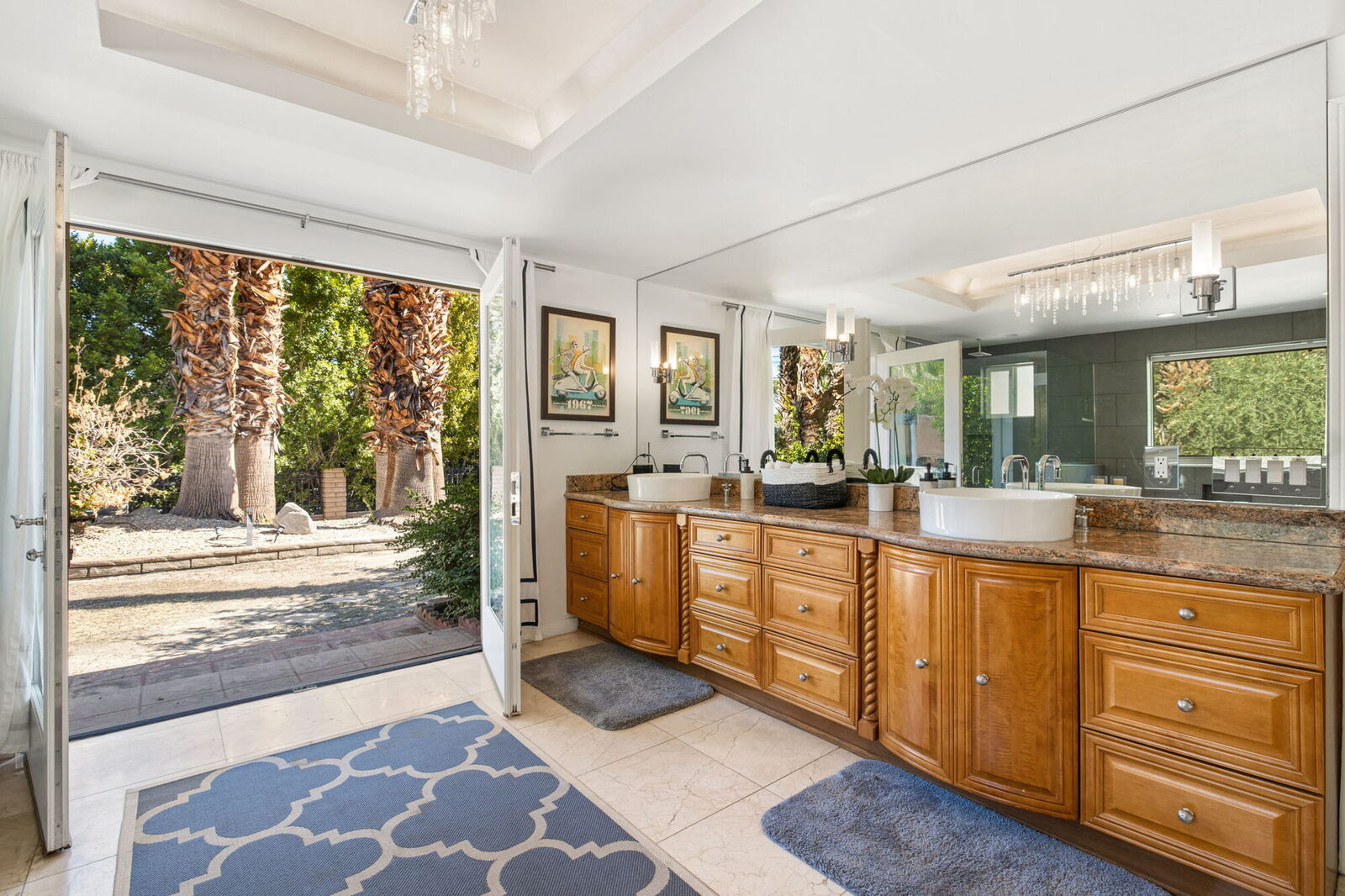 Primary bath with a soaking tub and French doors opening to the garden