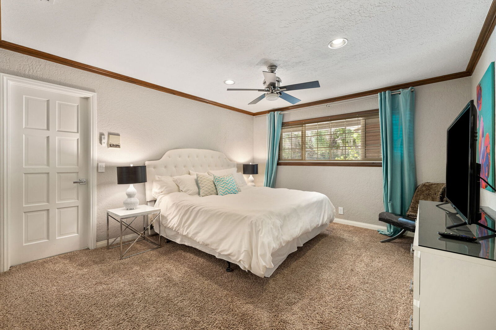 Primary bedroom with a king bed and mountain-view windows
